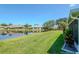 Beautiful backyard view with well-manicured lawn, and relaxing view of the pond at 717 Manchester Woods Dr # 717, Sun City Center, FL 33573