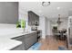 Modern kitchen with grey cabinets, stainless steel appliances, and white subway tile backsplash offers both style and functionality at 717 Manchester Woods Dr # 717, Sun City Center, FL 33573