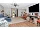 Open-concept living area with modern furnishings and decor, hardwood floors, and great natural light at 717 Manchester Woods Dr # 717, Sun City Center, FL 33573