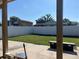 Expansive, well-maintained backyard featuring a new privacy fence, offering ample space for outdoor activities at 7321 W Pocahontas Ave, Tampa, FL 33634