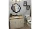 Bathroom features granite countertop vanity, framed mirror and modern fixtures at 7321 W Pocahontas Ave, Tampa, FL 33634