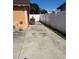 Long driveway providing plenty of parking, complemented by a tidy yard at 7321 W Pocahontas Ave, Tampa, FL 33634