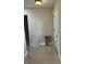 Hallway featuring neutral walls, tile flooring, white trim, and a front door at 7321 W Pocahontas Ave, Tampa, FL 33634
