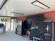 A spacious outdoor area with stainless steel appliances, ping pong table and cover offering entertainment and modern amenities at 7321 W Pocahontas Ave, Tampa, FL 33634