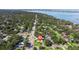 Beautiful aerial view of the property nestled in a neighborhood with mature trees and water views at 8200 31St N Ter, St Petersburg, FL 33710