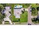 An aerial view of a charming home with a pool, spa and lush landscaping at 8200 31St N Ter, St Petersburg, FL 33710