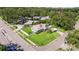 Aerial view of property showcasing the well-manicured lawn, fenced backyard, and mature trees at 8200 31St N Ter, St Petersburg, FL 33710
