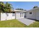 Cozy backyard patio with double doors for indoor/outdoor living, and a lush green lawn at 8200 31St N Ter, St Petersburg, FL 33710