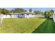 Spacious fenced backyard with lush lawn and mature landscaping at 8200 31St N Ter, St Petersburg, FL 33710