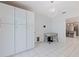 Open dining area showing bright white tile floors and decor at 8200 31St N Ter, St Petersburg, FL 33710
