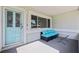 Welcoming front porch with seating area, blue door, and great natural light at 8200 31St N Ter, St Petersburg, FL 33710