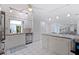Bright white kitchen featuring stainless steel appliances and tile floors with an open plan at 8200 31St N Ter, St Petersburg, FL 33710