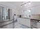 Bright white kitchen with stainless steel refrigerator, oven, and updated appliances and finishes at 8200 31St N Ter, St Petersburg, FL 33710