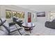 Bright living room features a large window, tile floors, and comfortable seating at 8200 31St N Ter, St Petersburg, FL 33710