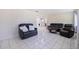 Spacious living room boasts tile floors and is decorated with sleek, modern furniture at 8200 31St N Ter, St Petersburg, FL 33710