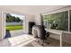 Office area with desk, chair, and doorway to a large backyard at 8200 31St N Ter, St Petersburg, FL 33710