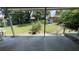 View of the expansive backyard from the covered patio with the wooden fence at 8211 Diagonal N Rd, St Petersburg, FL 33702