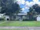 Charming single-story home with mature trees and landscaping in a quiet neighborhood at 8211 Diagonal N Rd, St Petersburg, FL 33702