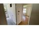 Hallway view into a bedroom, showcasing doorway, closet, and natural light at 8211 Diagonal N Rd, St Petersburg, FL 33702