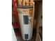 Rheem water heater inside of home with visible piping and energy guide at 8211 Diagonal N Rd, St Petersburg, FL 33702