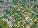 Aerial view of a residential community featuring well-maintained homes, lush trees, and green spaces at 8336 Monaco Dr # A, Port Richey, FL 34668