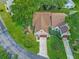 Aerial view of a charming home with lush landscaping, a well-manicured lawn, and inviting curb appeal at 8336 Monaco Dr # A, Port Richey, FL 34668