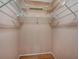 Walk in closet with wire shelving and hardwood floors at 8336 Monaco Dr # A, Port Richey, FL 34668