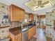 Bright kitchen with stainless steel appliances, granite countertops, and abundant cabinet space at 8336 Monaco Dr # A, Port Richey, FL 34668
