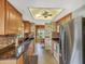 Well-lit kitchen featuring stainless steel appliances and ample counter space at 8336 Monaco Dr # A, Port Richey, FL 34668