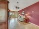 Comfortable living room with tile flooring, ceiling fan, and a cozy seating area at 8336 Monaco Dr # A, Port Richey, FL 34668