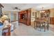Spacious living area with tile floors, built-in entertainment center and adjacent dining space at 8336 Monaco Dr # A, Port Richey, FL 34668