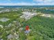 Birds eye view shows this property is near Little Rd, many trees, and some commercial properties at 8711 Crescent Forest Blvd, New Port Richey, FL 34654
