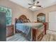 Bedroom with wood-look floors and a large window that brings in light, creating a tranquil space at 8711 Crescent Forest Blvd, New Port Richey, FL 34654
