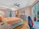 Serene bedroom with hardwood floors, dresser, and a view into the ensuite dining room at 8711 Crescent Forest Blvd, New Port Richey, FL 34654