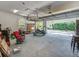Well-lit garage featuring ample storage, a work area, and an open layout for convenience at 8711 Crescent Forest Blvd, New Port Richey, FL 34654
