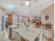 Bright and airy kitchen featuring a spacious island, modern appliances, and an adjacent dining area, perfect for Gathering gatherings at 8711 Crescent Forest Blvd, New Port Richey, FL 34654