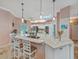 Gourmet kitchen featuring custom cabinetry, a large island, and state-of-the-art appliances at 8711 Crescent Forest Blvd, New Port Richey, FL 34654