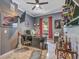 Home office with dark walls, a large desk, and custom shelving with decor at 8711 Crescent Forest Blvd, New Port Richey, FL 34654