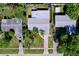 This home features a well-manicured lawn, mature trees, and a driveway leading to the one car garage at 8848 56Th N Way, Pinellas Park, FL 33782