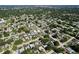 This is an aerial view of the neighborhood, showcasing the area's layout with mature trees and sidewalks at 8848 56Th N Way, Pinellas Park, FL 33782