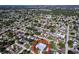 An aerial view shows the property's location in a neighborhood filled with mature trees in a desirable location at 8848 56Th N Way, Pinellas Park, FL 33782