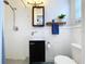 This updated bathroom features modern fixtures, white tile, and a stylish vanity for a clean and fresh look at 8848 56Th N Way, Pinellas Park, FL 33782
