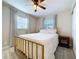 Cozy bedroom featuring natural light, plush carpeting, and a modern ceiling fan at 8848 56Th N Way, Pinellas Park, FL 33782
