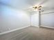 This bedroom has neutral paint and flooring and a double closet, offering a blank slate at 8848 56Th N Way, Pinellas Park, FL 33782