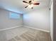 This bedroom features a ceiling fan and ample natural light from the window at 8848 56Th N Way, Pinellas Park, FL 33782