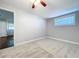 This cozy bedroom features a ceiling fan and ample natural light from the window at 8848 56Th N Way, Pinellas Park, FL 33782