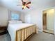 Bedroom with neutral decor, plush carpeting, and access to the en suite bathroom at 8848 56Th N Way, Pinellas Park, FL 33782