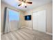 This bedroom features a ceiling fan, a TV, and a double closet with lots of storage at 8848 56Th N Way, Pinellas Park, FL 33782