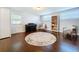Versatile bonus room with a piano, bookshelf, ample natural light, and hardwood floors at 8848 56Th N Way, Pinellas Park, FL 33782