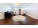 Bonus room with hardwood floors, featuring a piano, seating area, and natural light at 8848 56Th N Way, Pinellas Park, FL 33782